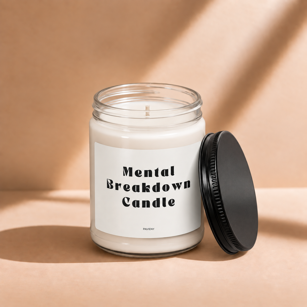 Open 9oz Mental Breakdown scented soy candle with the black lid beside the clear glass jar.