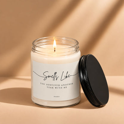 Lit Another Year With Me candle by Pavieny in a glass jar, a funny birthday gift for a partner or someone with a playful sense of humor.
