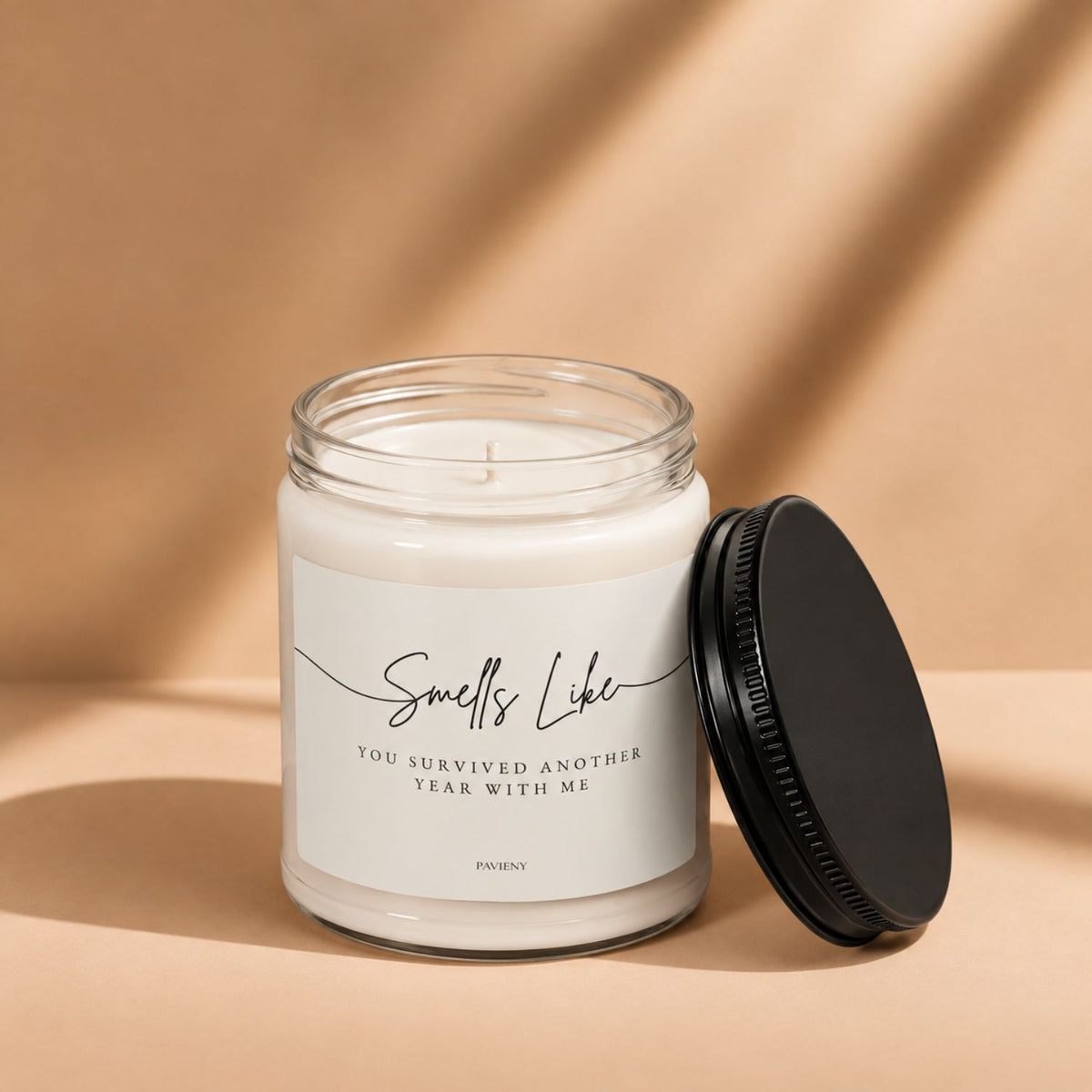 Open Another Year With Me scented candle by Pavieny showing the wax surface and cotton wick, designed as a humorous birthday gift.