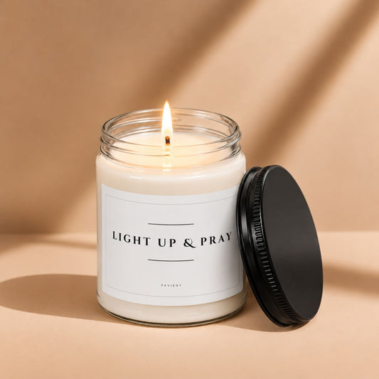 Lit Light Up and Pray Christian candle by Pavieny in a glass jar, a thoughtful faith-inspired scented candle gift.