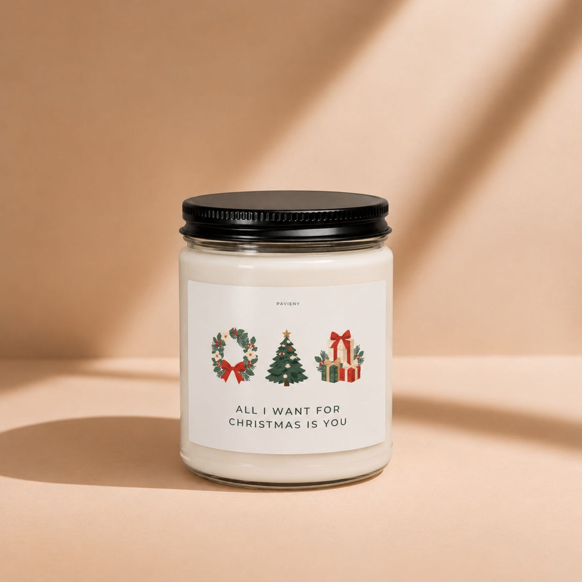 All I Want for Christmas candle by Pavieny with its Christmas-themed label displayed on the closed glass jar, a festive holiday gift.