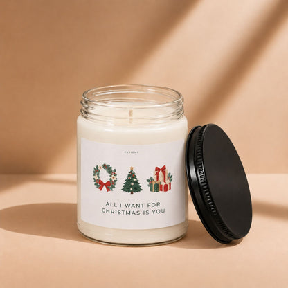 Open All I Want for Christmas candle by Pavieny showing the wax surface and cotton wick, a seasonal scented candle for Christmas.