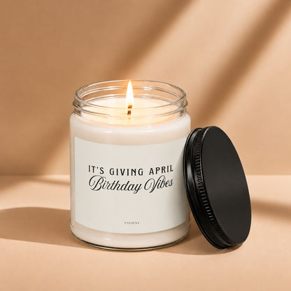 Lit April birthday scented candle in a glass jar, a thoughtful gift for someone celebrating an April birthday.
