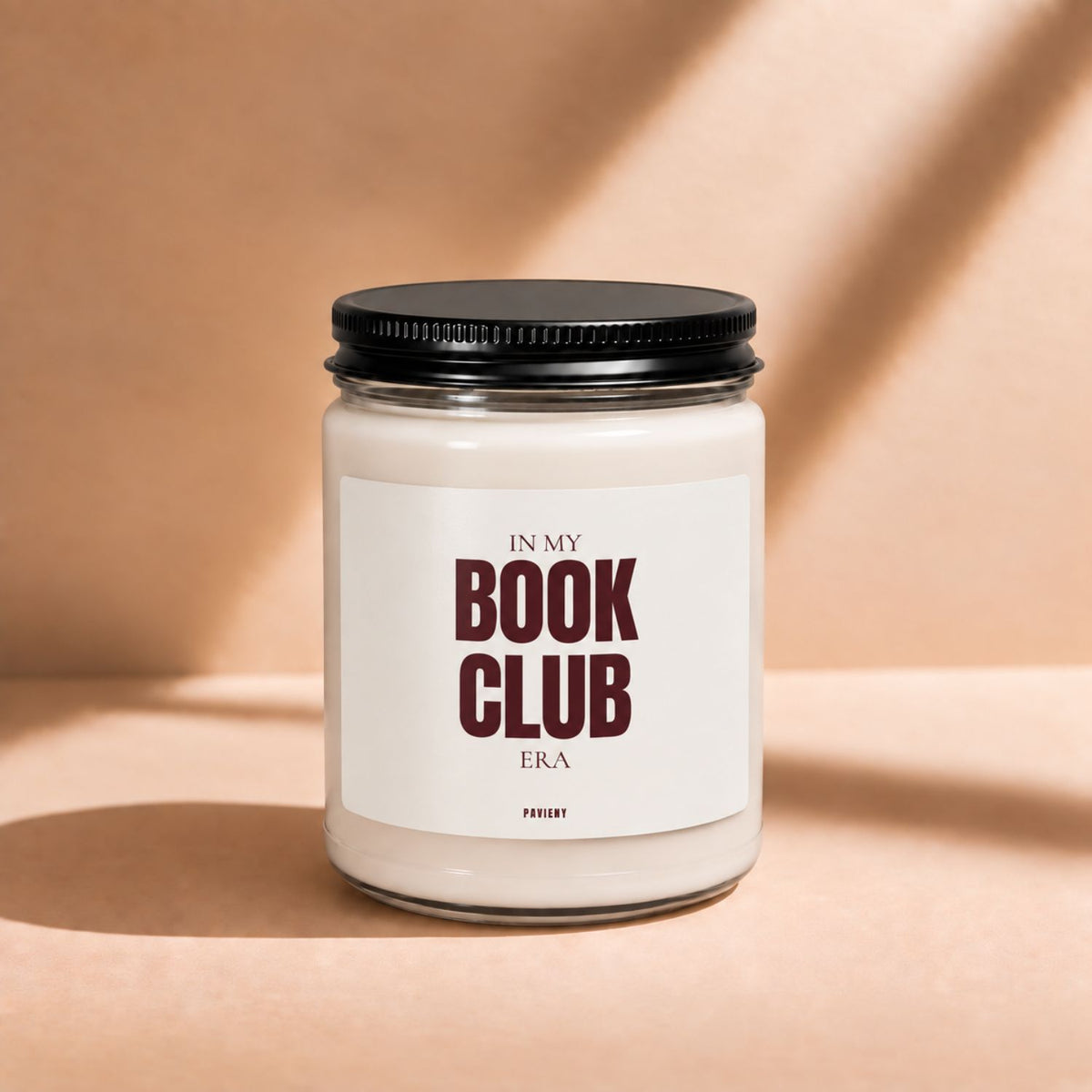 Front view of a 9oz scented candle featuring a literary “Book Club” label.