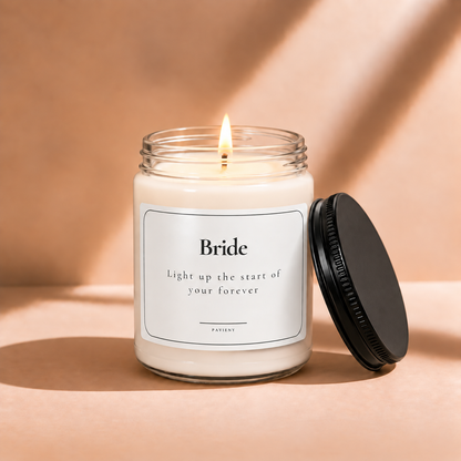 Lit 9oz Bride scented soy candle with a warm flame, a thoughtful bridal shower and wedding gift for a bride-to-be.