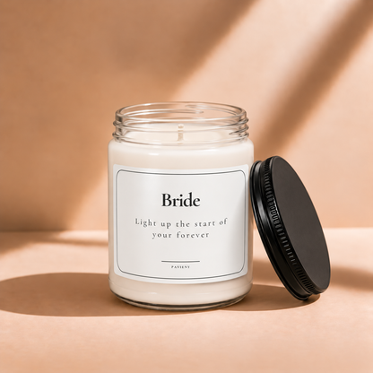 Open 9oz Bride scented soy candle with the black lid beside the clear glass jar.