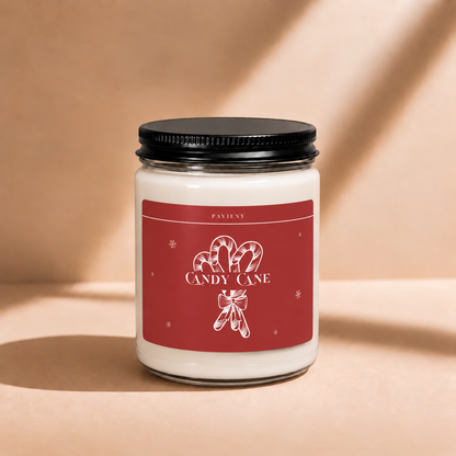 Closed 9oz Candy Cane scented soy candle with a black lid, a sweet and festive Christmas gift for friends and family.