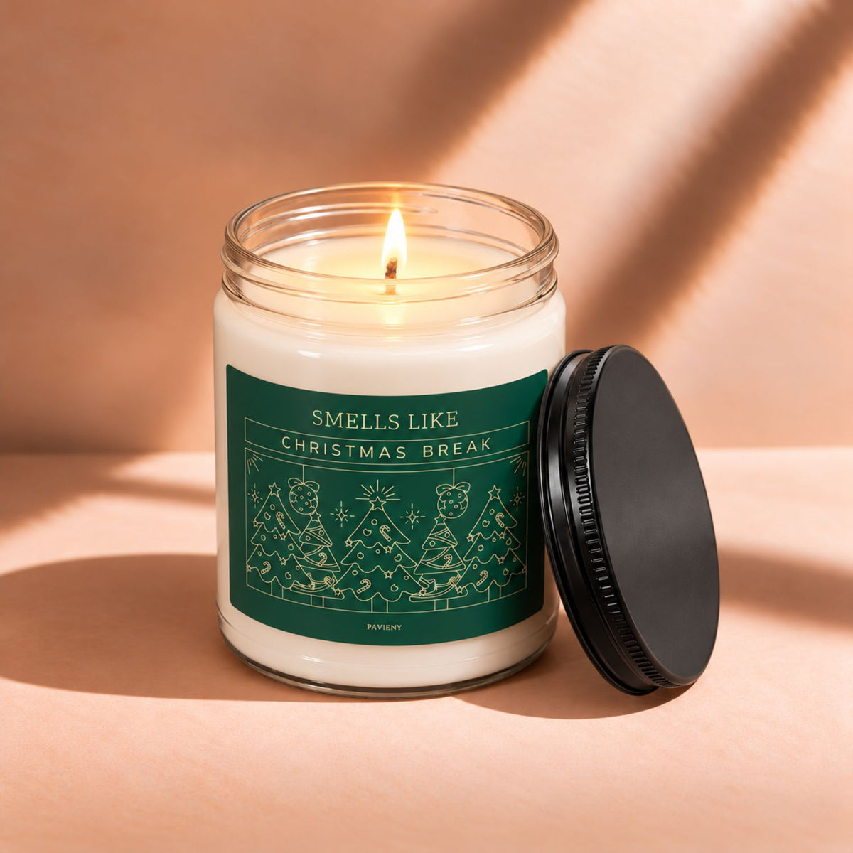 Lit 9oz Christmas Break scented soy candle with a warm flame, a fun and relaxing holiday gift.