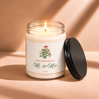 Lit First Christmas scented candle creating a warm atmosphere for a special holiday milestone.
