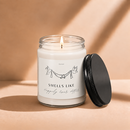 Lit 9oz Happily Ever After scented soy candle with a warm flame, a romantic wedding and engagement gift for couples.