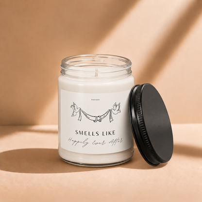 Open 9oz Happily Ever After scented soy candle with the black lid beside the clear glass jar.