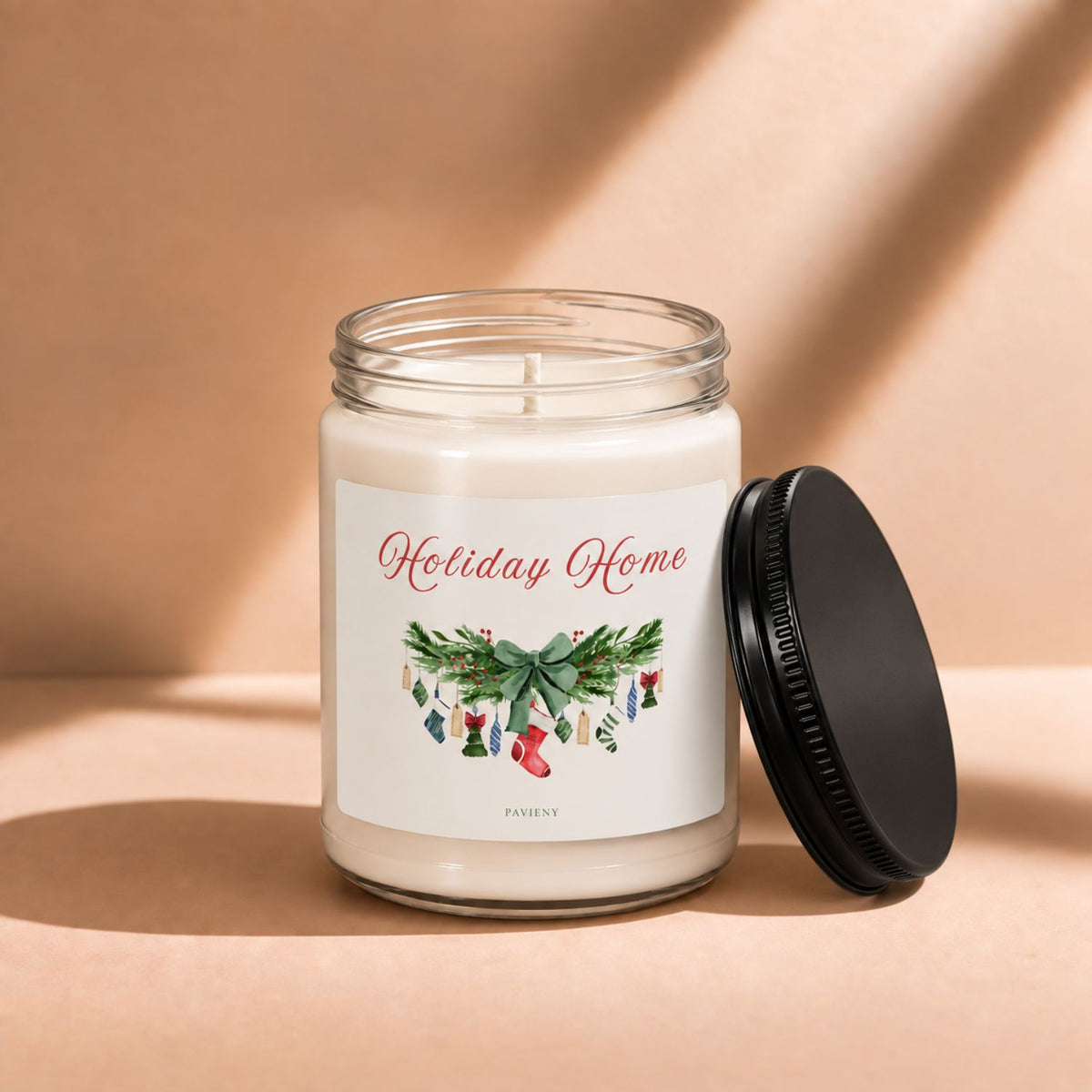 Open 9oz Holiday Home Christmas candle with the black lid beside the glass jar.