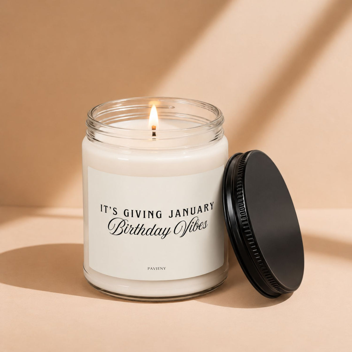 Lit January Birthday scented candle, a warm and thoughtful birthday gift for January birthdays.