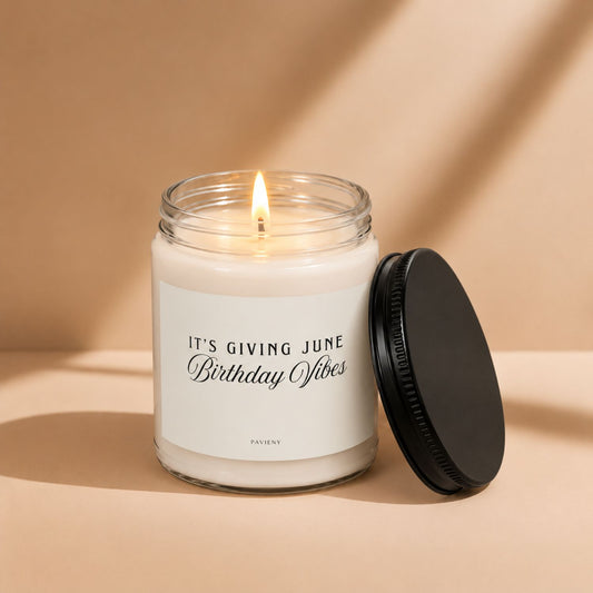 Lit June birthday scented candle in a glass jar, a thoughtful birthday gift for someone celebrating in June.