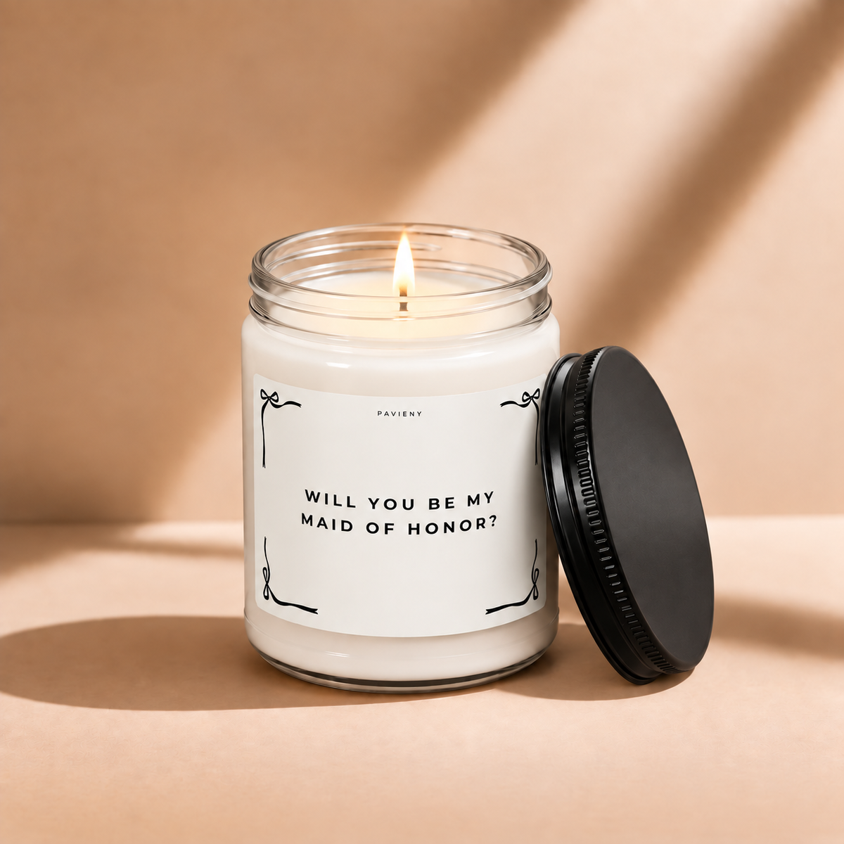 Lit 9oz Maid of Honor scented soy candle with a warm flame, a thoughtful bridesmaid proposal and wedding gift.