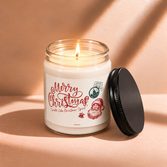 Lit 9oz Merry Christmas scented soy candle with a warm flame and festive holiday design.