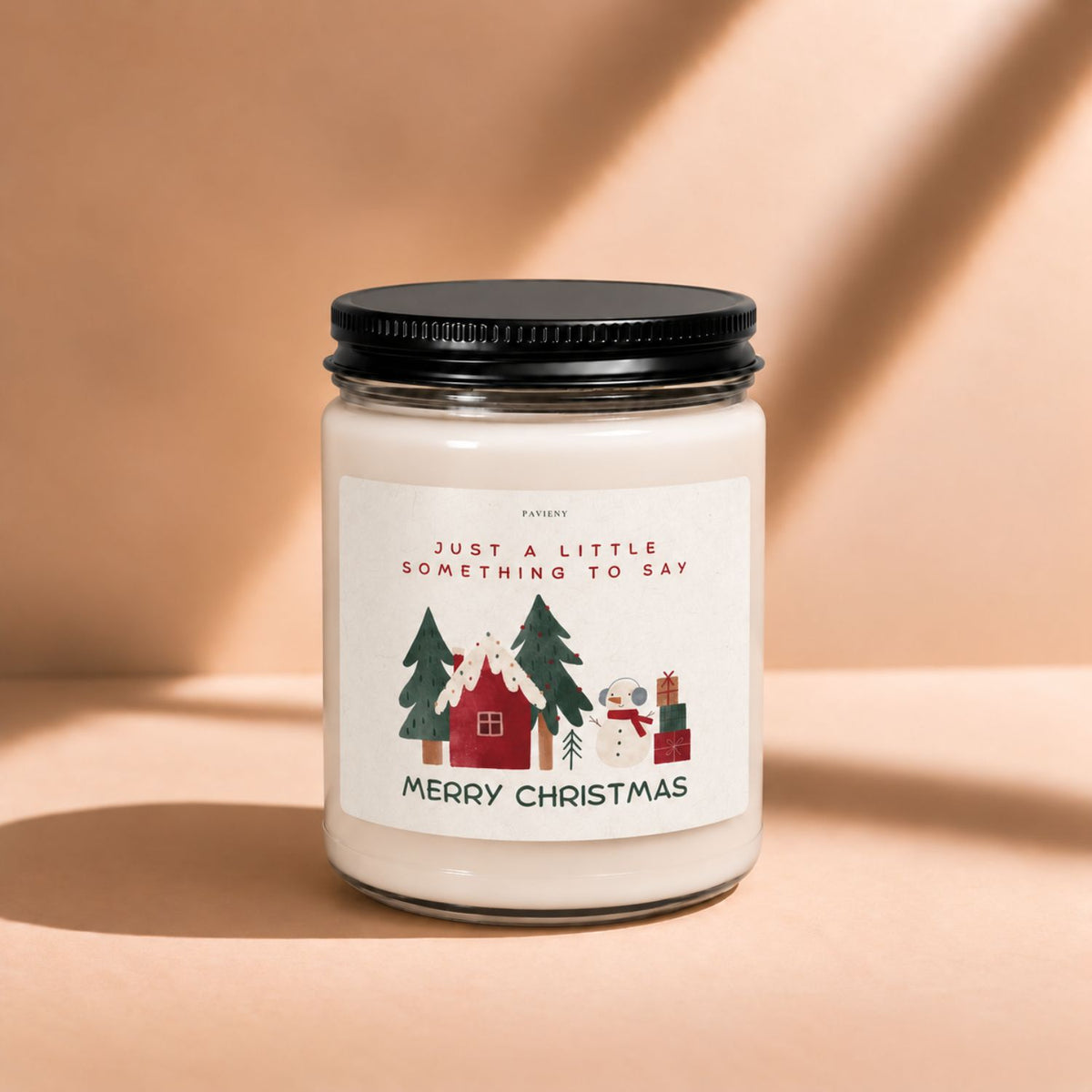 Front view of a 9oz scented candle featuring a festive “Merry Christmas” label.