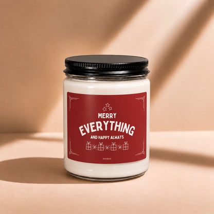 Front view of a 9oz scented candle featuring a festive “Merry Everything” holiday label.