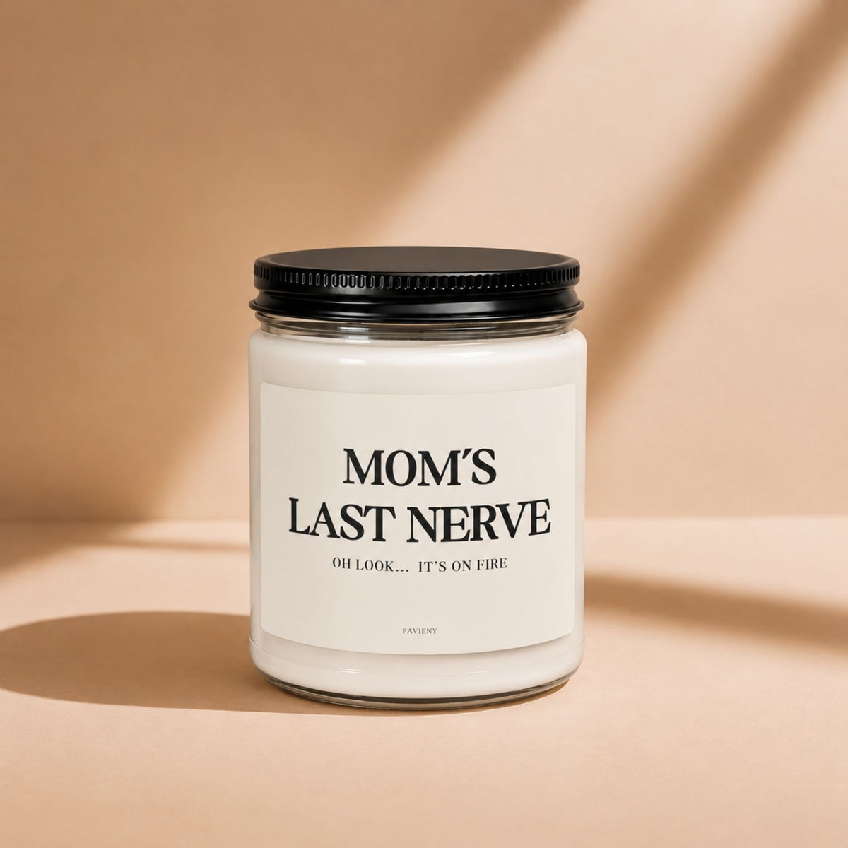 Mom's Last Nerve Candle in a glass jar with its lid closed, a humorous scented candle gift for mom.