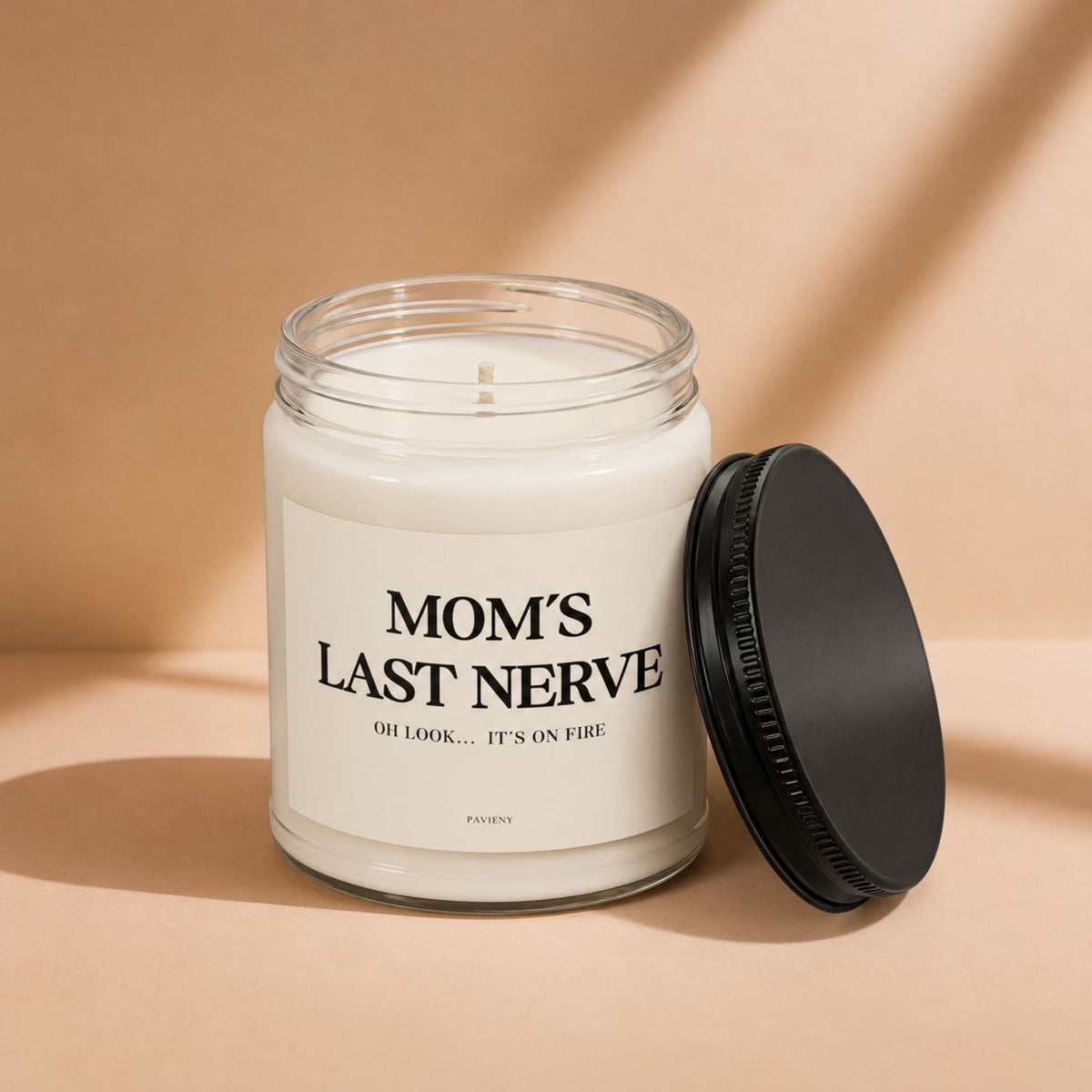 Mom's Last Nerve Candle with the lid removed, showing the candle wax and label, a funny gift idea for moms.