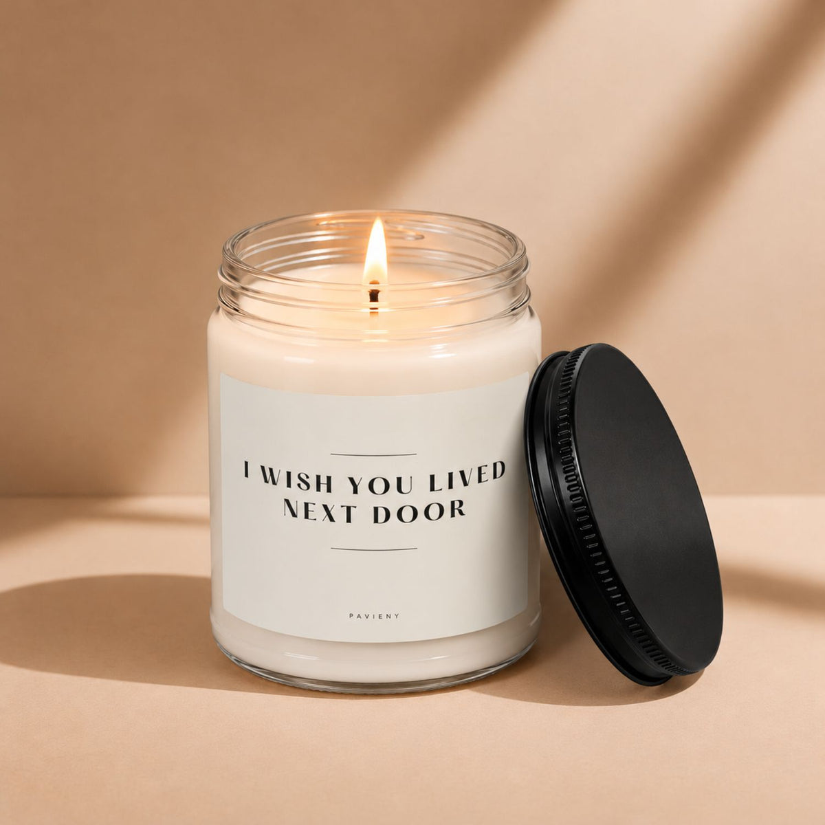Lit Next Door scented candle, a cozy gift idea for a neighbor or new homeowner.