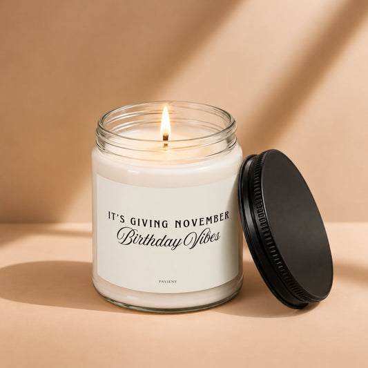 Lit November birthday scented candle in a glass jar, a thoughtful birthday gift for someone born in November.