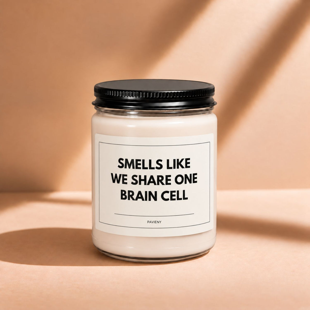 Closed 9oz One Brain Cell scented soy candle with a black lid, a humorous friendship gift.