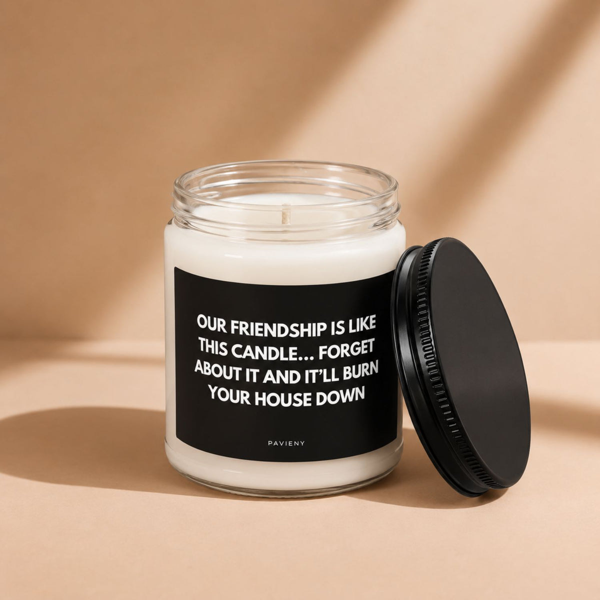 Our Friendship scented candle with the wax and wick visible, a meaningful gift for friends.