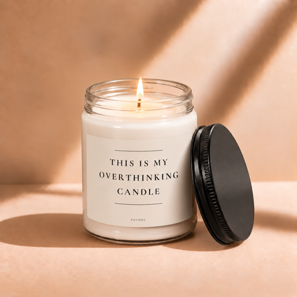 Lit 9oz Overthinking scented soy candle with a warm flame, a funny stress relief and self-care gift.