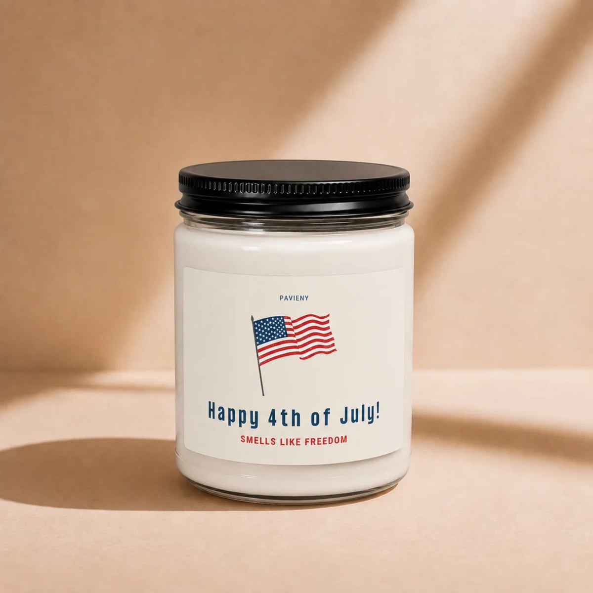 Closed 9oz Smells Like Freedom scented soy candle with a black lid, a fun patriotic gift.