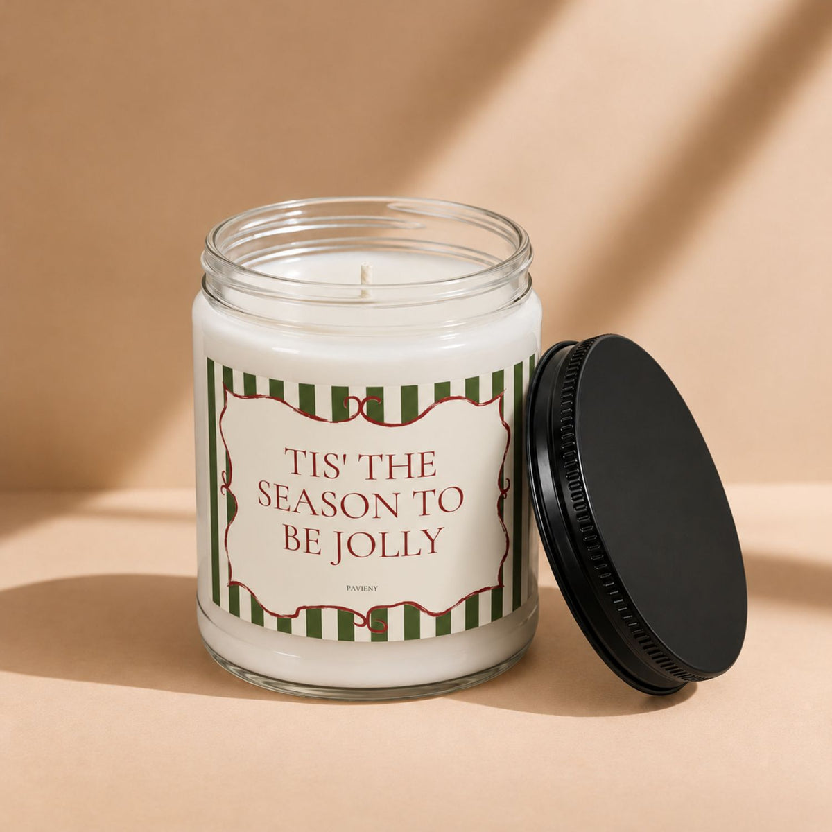 Tis' the Season scented candle with the wax and wick visible, perfect for cozy seasonal moments and holiday gifting.