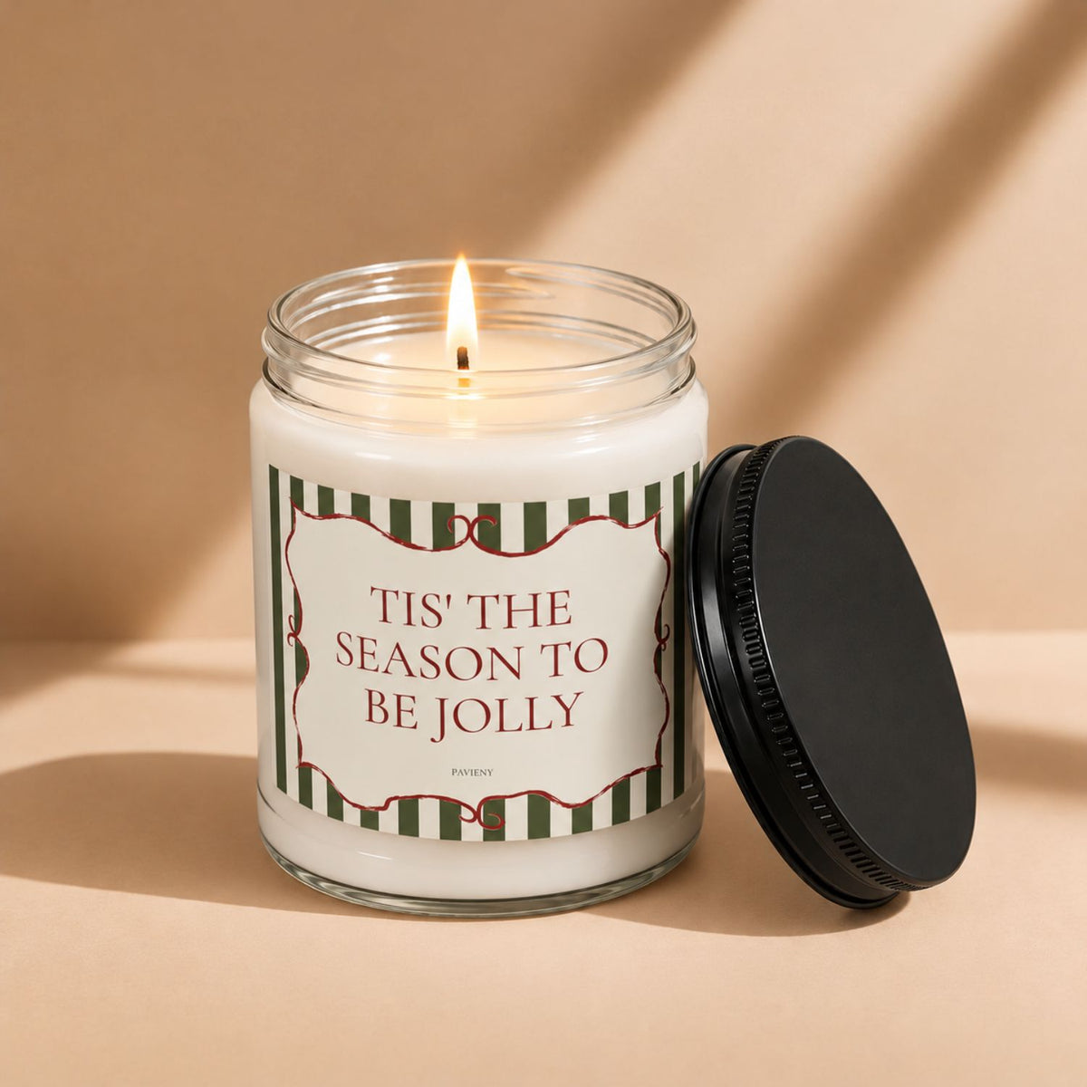 Lit Tis' the Season scented candle, creating a warm and cozy atmosphere for the holiday season.